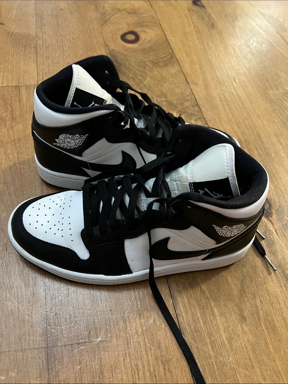 Jordan Black and White Mid-Top Sneakers
